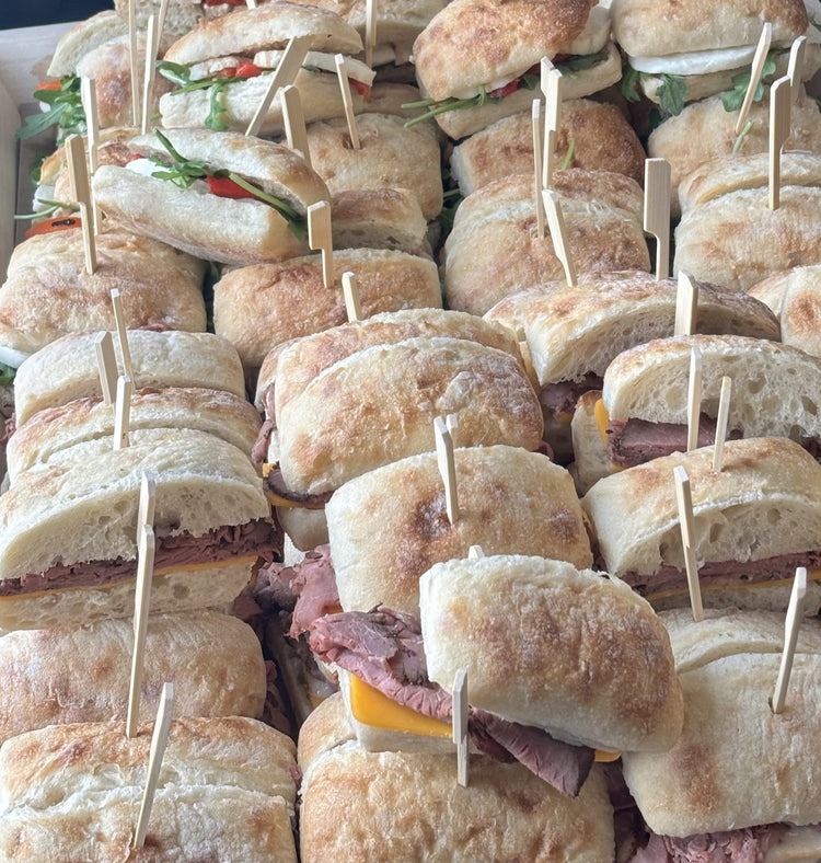 Catered food spread served alongside North Arrow coffee at an event